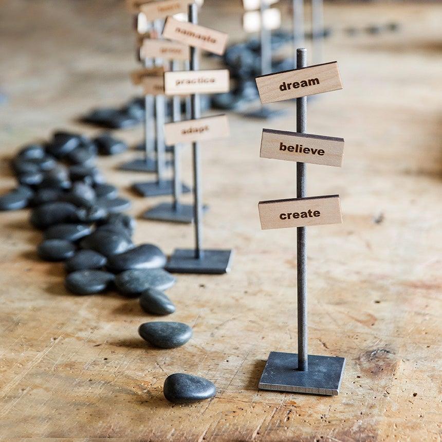 steel desktop stands with zen rocks decorated with magnetic intention blocks